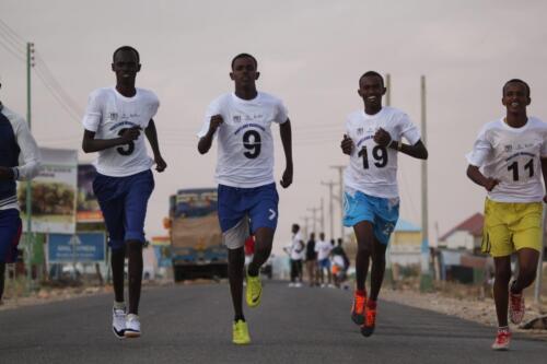 Group of Youth runners picking up the pace